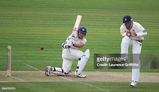 Joe Sayers of Yorkshire hits out as Jonathan Trott of Warwickshire takes evasive action during the LV County Championship Division One match between...