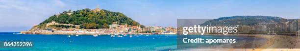 panoramic view of la concha bay and beach, san sebastian, donostia, basque country, spain - san sebastian spain beach stock pictures, royalty-free photos & images