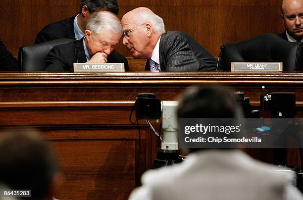 Senate Judiciary Committee Chairman Patrick Leahy talks with the newly-appointed committee ranking member Sen. Jeff Sessions while hearing testimony...