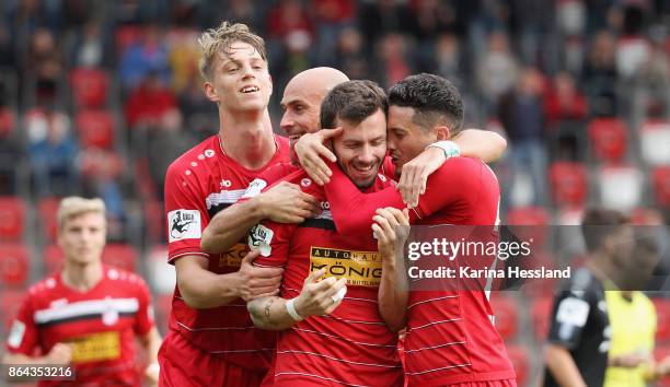 Carsten Kammlott of Erfurt celebrates the opening goal with teammates during the 3.Liga match between FC Rot-Weiss Erfurt and Hallescher FC at Arena...