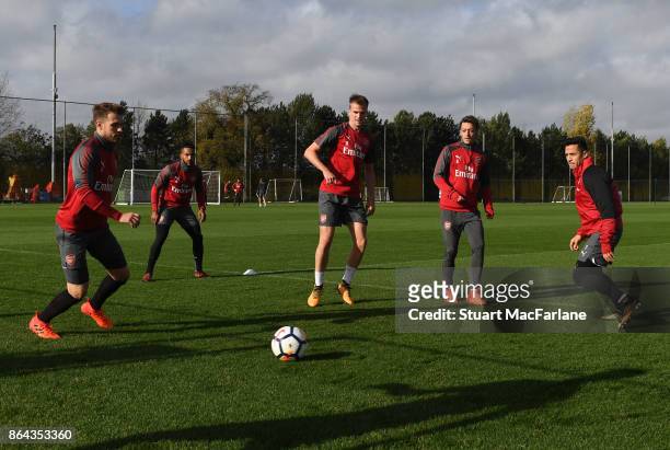 Aaron Ramsey, Rob Holding, Mesut Ozil and Alexis Sanchez of Arsenal during a training session at London Colney on October 21, 2017 in St Albans,...