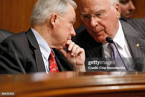 Senate Judiciary Committee Chairman Patrick Leahy talks with the newly-appointed committee ranking member Sen. Jeff Sessions while hearing testimony...