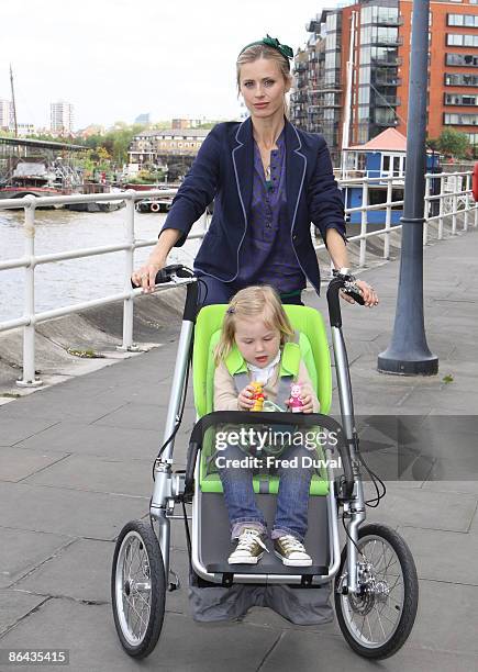 Laura Bailey with child model attends photocall to launch a new design from Dutch brand Taga at Design Museum on May 6, 2009 in London, England.