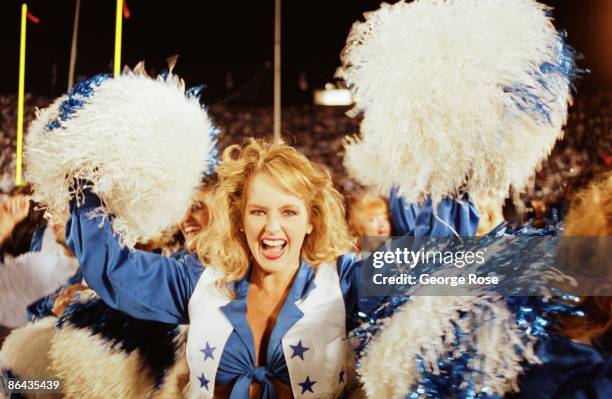 Dallas Cowboys Cheerleader celebrates the Dallas Cowboy's 1993 Pasadena, California, Superbowl XXVII win over the Buffalo Bills. The Cowboys won...