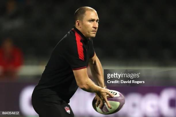 Pierre Mignoni, head coach of Lyon, passes the ball during the European Rugby Challenge Cup match between Lyon and Sale Sharks at Matmut Stade de...