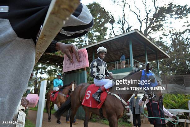 Aileen Kimutai A photo taken on May 3, 2009 shows Kenyan jockeys arriving for a race at the Ngong race-course in Nairobi. Started in 1904 in Kenya as...