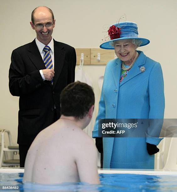 Britian's Queen Elizabeth smiles as she visits the Hydro therapy section at Altnagelvin Hospital in Londonderry, Northern Ireland on May 6, 2009. The...
