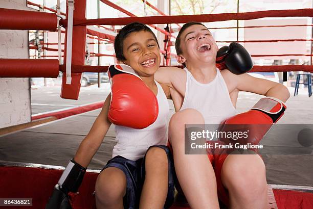 two young boxers sharing a moment. - kid boxing stock pictures, royalty-free photos & images