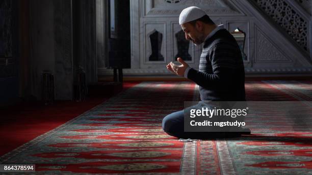 muslims prayer in mosque - islam stock pictures, royalty-free photos & images