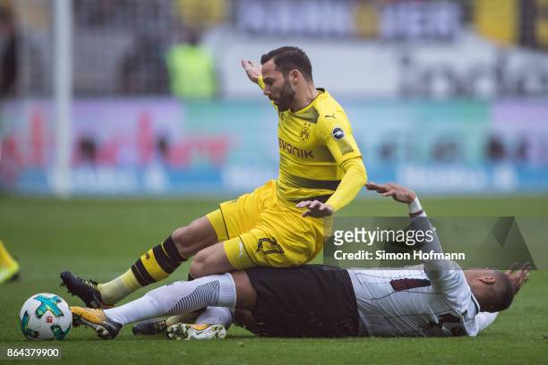 Gonzalo Castro of Dortmund is tackled by Kevin-Prince Boateng of Frankfurt during the Bundesliga match between Eintracht Frankfurt and Borussia...