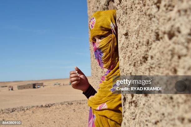 Sahrawi refugee Selembouha Dadi stands at her house at the Boujdour camp for Sahrawi refugees on the outskirts of Tindouf, south west of Algeria, on...