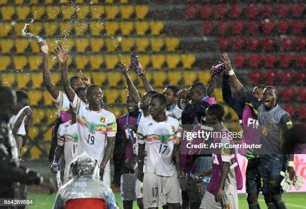 Mali football players celebrate after winning against Ghana at the FIFA U-17 World Cup quarterfinal match between Mali and Ghana at Indira Gandhi...