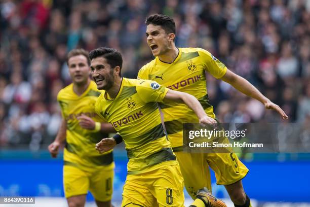 Nuri Sahin of Dortmund celebrates his team's first goal with team mate Marc Bartra during the Bundesliga match between Eintracht Frankfurt and...