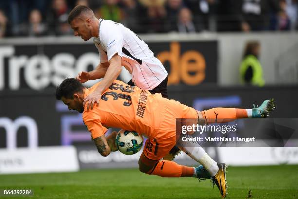 Roman Buerki of Dortmund saves against Ante Rebic of Frankfurt during the Bundesliga match between Eintracht Frankfurt and Borussia Dortmund at...