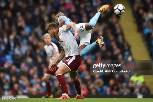 Manchester City's Brazilian midfielder Fernandinho challenges Burnley's Irish midfielder Jeff Hendrick during the English Premier League football...