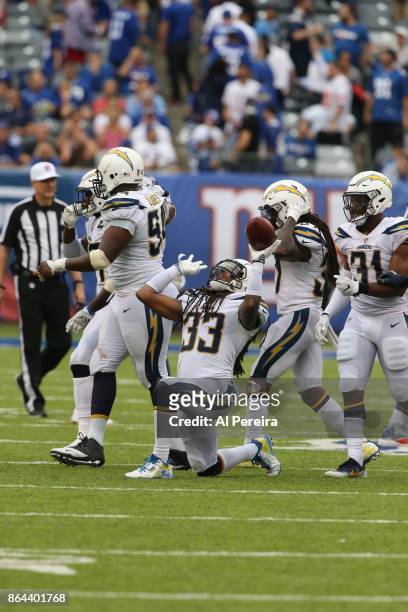 Safety Tre Boston of the Los Angeles Chargers has an interception in action against the New York Giants during an NFL game at MetLife Stadium on...