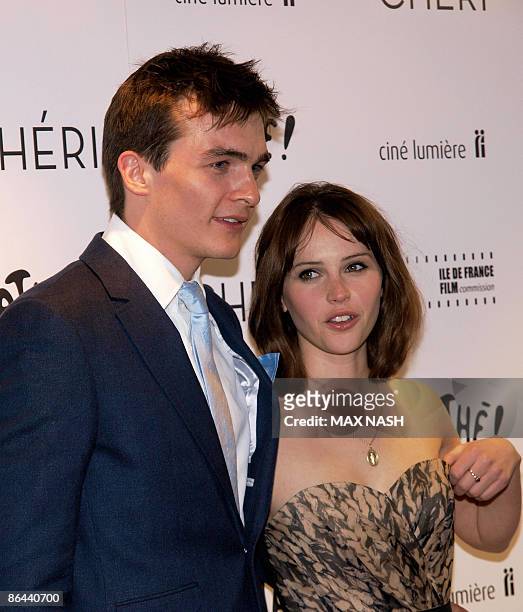 British actress Felicility Jones arrives with her co-star Rupert Friend at the British Premiere of their latest film ' Cheri' at the French...