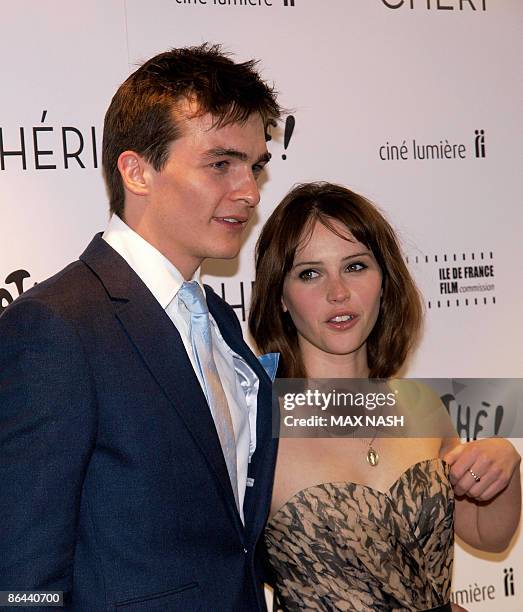 British actress Felicility Jones arrives with her co-star Rupert Friend at the British Premiere of their latest film ' Cheri' at the French...