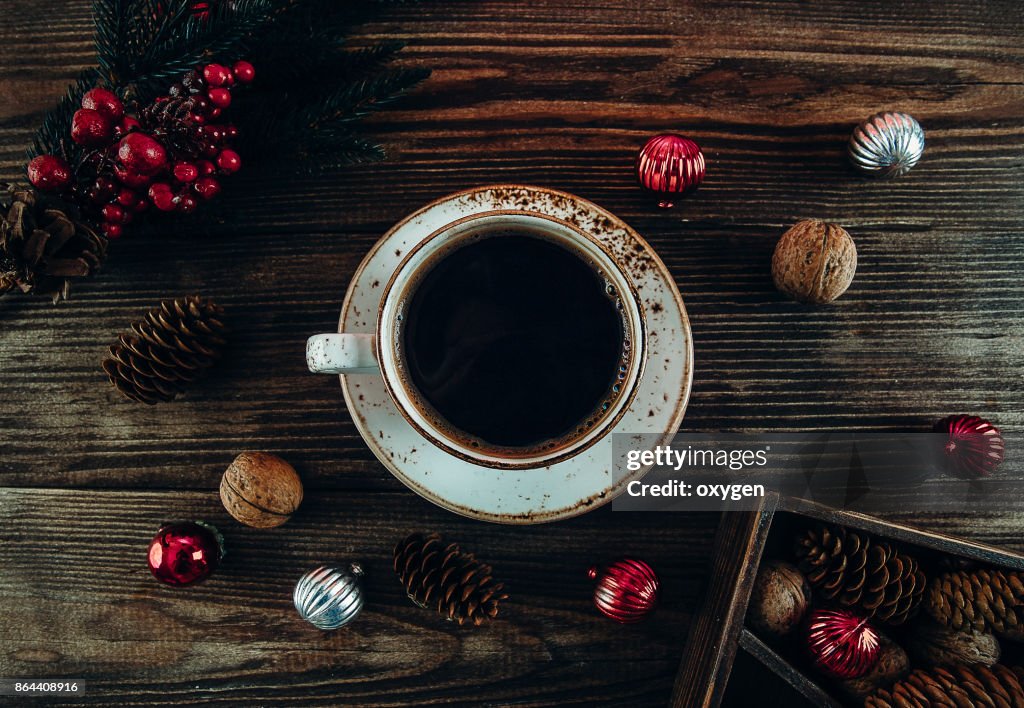 Christmas Decor with Cup of Coffee on Dark Wooden Background