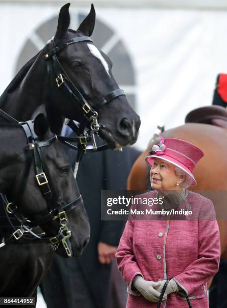 Queen Elizabeth II reviews the King's Troop Royal Horse Artillery during their 70th anniversary parade in Hyde Park on October 19, 2017 in London,...