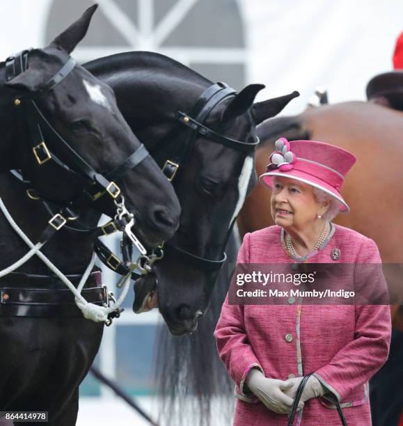 Queen Elizabeth II reviews the King's Troop Royal Horse Artillery during their 70th anniversary parade in Hyde Park on October 19, 2017 in London,...