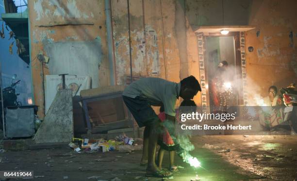 People in the Purasawakkam district set off firecrackers and sparklers to celebrate Diwali night on Wednesday, October 18, 2017 in Chennai, Tamil...