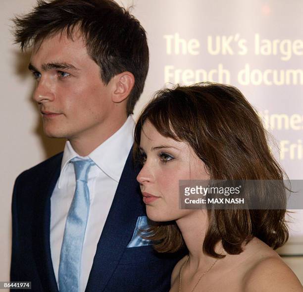 British actress Felicility Jones arrives with her co-star Rupert Friend at the British Premiere of their latest film ' Cheri' at the French...