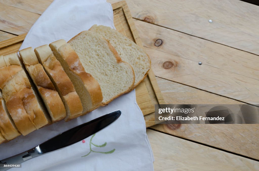 Loaf of sliced bread on a chopping board