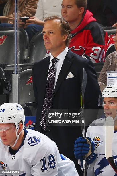 Head Jon Cooper of the Tampa Bay Lightning looks on against the New Jersey Devils during the game at Prudential Center on October 17, 2017 in Newark,...