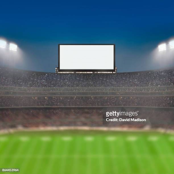 jumbotron large scale screen in sports stadium - großbildschirm stock-fotos und bilder