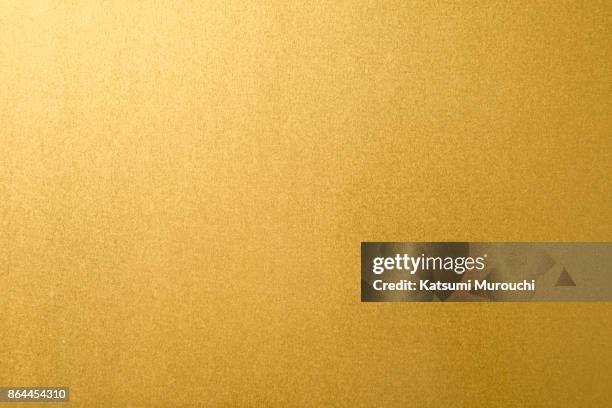 gold paper texture background - gold coloured stock pictures, royalty-free photos & images