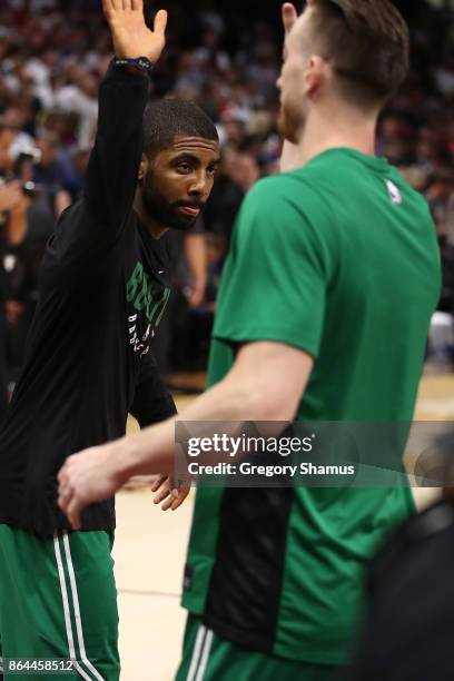 Kyrie Irving of the Boston Celtics high fives Gordon Hayward during introductions prior to playing the Cleveland Cavaliers at Quicken Loans Arena on...