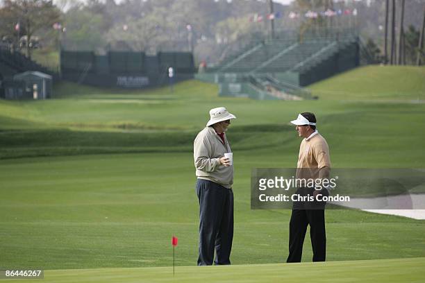 Phil Mickelson works with short-game coach Dave Pelz during an early practice round on the stadium course Saturday, in preparation for the 2005 THE...