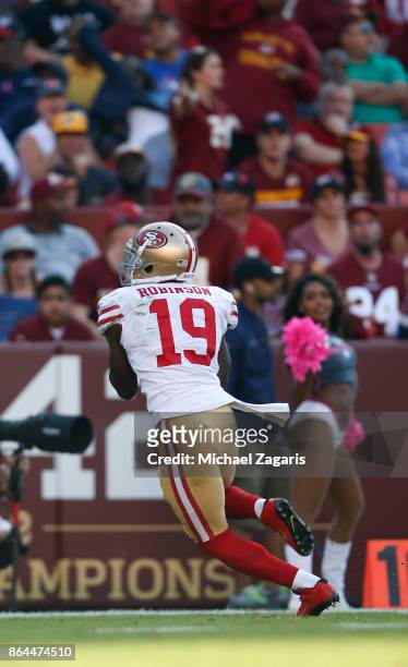 Aldrick Robinson of the San Francisco 49ers heads to the end zone on a 45-yard touchdown reception during the game against the Washington Redskins at...