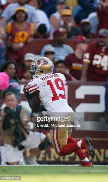 Aldrick Robinson of the San Francisco 49ers heads to the end zone on a 45-yard touchdown reception during the game against the Washington Redskins at...