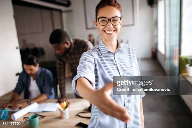 a handshake - facial expression girl office stock pictures, royalty-free photos & images