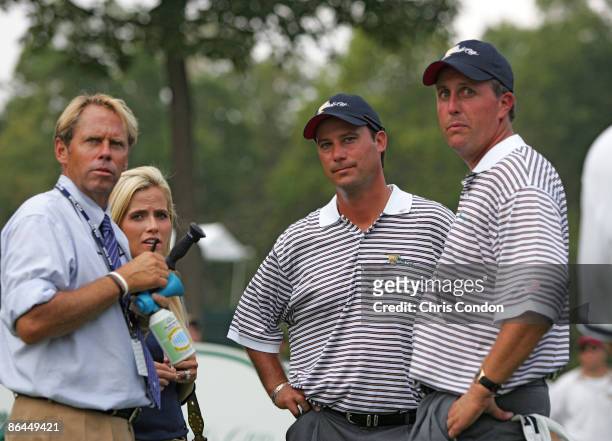 Rules official John Brendle and Amy Mickelson with Chris DiMarco and Phil Mickelson of the U.S. Team during the second round of The Presidents Cup at...