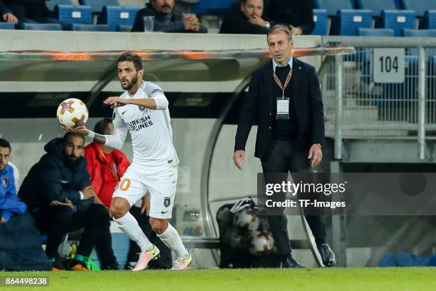 Junior Caicara of Istanbul Basaksehir controls the ball Head coach Abdullah Avci of Istanbul Basaksehir looks on during the UEFA Europa League Group...