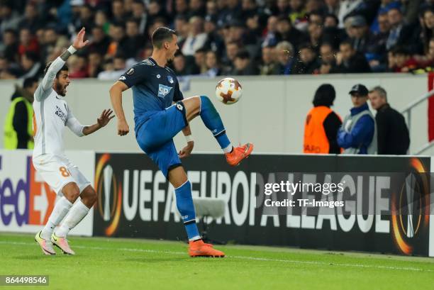 Junior Caicara of Istanbul Basaksehir and Sandro Wagner of Hoffenheim battle for the ball during the UEFA Europa League Group C match between 1899...