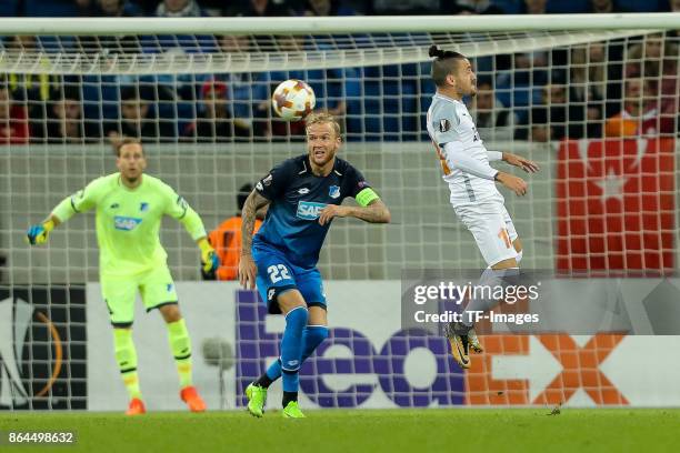 Kevin Vogt of Hoffenheim and Stefano Napoleoni of Istanbul Basaksehir battle for the ball during the UEFA Europa League Group C match between 1899...