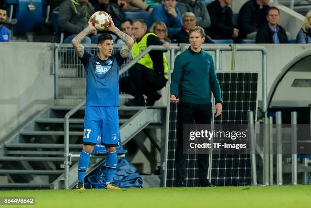 Steven Zuber of Hoffenheim controls the ball Head coach Julian Nagelsmann of Hoffenheim looks on during the UEFA Europa League Group C match between...