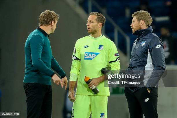 Head coach Julian Nagelsmann of Hoffenheim speak with Goalkeeper Oliver Baumann of Hoffenheim during the UEFA Europa League Group C match between...