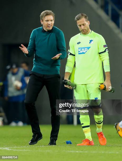 Head coach Julian Nagelsmann of Hoffenheim speak with Goalkeeper Oliver Baumann of Hoffenheim during the UEFA Europa League Group C match between...