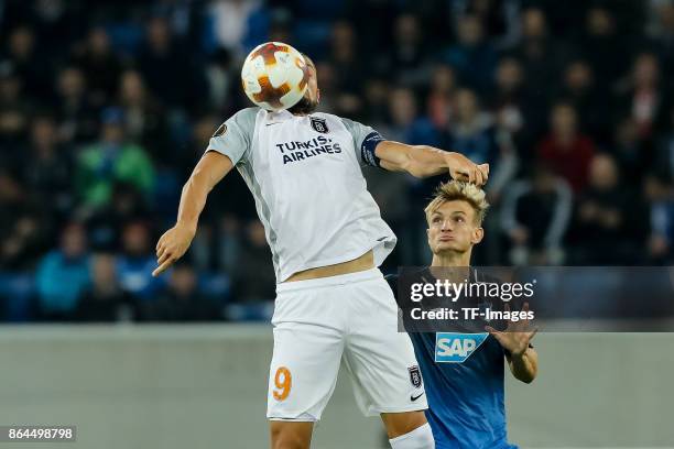 Mehmet Batdal of Istanbul Basaksehir and Stefan Posch of Hoffenheim battle for the ball during the UEFA Europa League Group C match between 1899...