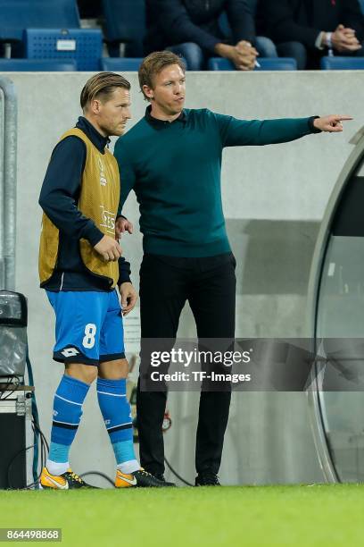 Head coach Julian Nagelsmann of Hoffenheim speak with Eugen Polanski of Hoffenheim during the UEFA Europa League Group C match between 1899...