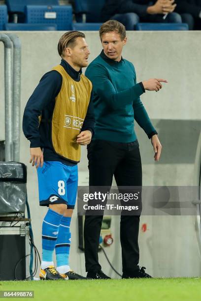 Head coach Julian Nagelsmann of Hoffenheim speak with Eugen Polanski of Hoffenheim during the UEFA Europa League Group C match between 1899...