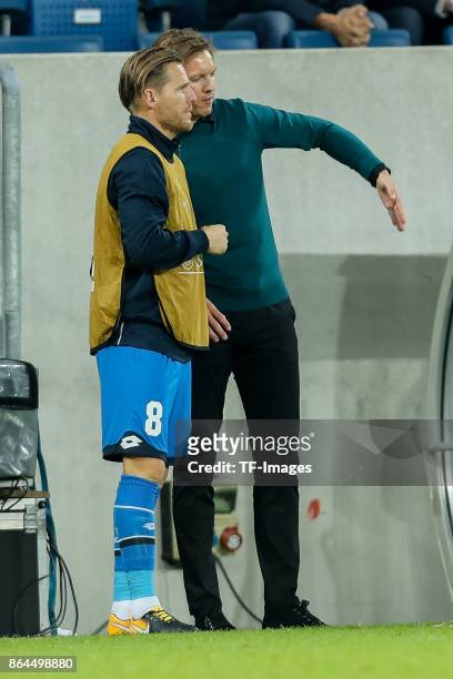 Head coach Julian Nagelsmann of Hoffenheim speak with Eugen Polanski of Hoffenheim during the UEFA Europa League Group C match between 1899...