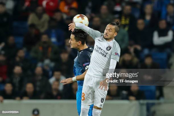 Benjamin Huebner of Hoffenheim and Mossoro of Istanbul Basaksehir battle for the ball during the UEFA Europa League Group C match between 1899...