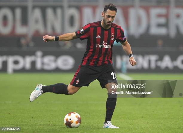 Hakan Calhanoglu of AC Milan in action during the UEFA Europa League group D match between AC Milan and AEK Athens at Stadio Giuseppe Meazza on...