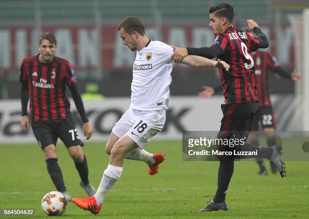 Jakob Johansson of AEK Athens is challenged by Andre Silva of AC Milan during the UEFA Europa League group D match between AC Milan and AEK Athens at...
